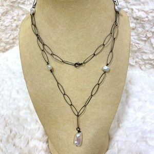 Pearl necklace handmade jewelry from two fish designs.